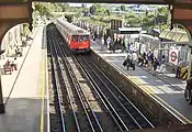 West Brompton underground station platforms, with northbound train arriving (September 2006)