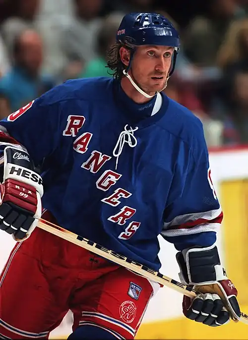 Image 6Wayne GretzkyPhoto credit: Håkan DahlströmIce hockey player Wayne Gretzky, as a member of the New York Rangers of the National Hockey League (NHL) in 1997. Gretzky, nicknamed "The Great One", is widely considered the best hockey player of all time. Upon his retirement in 1999, he held forty regular-season records, fifteen playoff records, and six All-Star records. He is the only NHL player to total over 200 points in one season—a feat he accomplished four times. In addition, he tallied over 100 points in 15 NHL seasons, 13 of them consecutively. He is the only player to have his number (99) officially retired by the NHL for all teams.More selected portraits