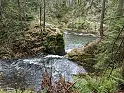 A minor waterfall below the bridge