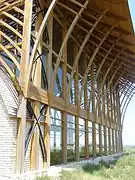 Detail: cedar beams and glass facade