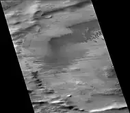 Biachini Crater, as seen by CTX camera (on Mars Reconnaissance Orbiter). Dust devil tracks and dunes are visible on the floor.  The narrow, dark lines are dust devil tracks.