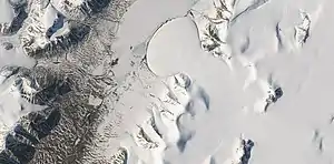 Elephant Foot Glacier in the Earth's Arctic, as seen by Landsat 8.  This picture shows several glaciers that have the same shape as many features on Mars that are believed to also be glaciers.