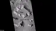 Wide CTX view showing mesa and buttes with lobate debris aprons and lineated valley fill around them.  Location is Ismenius Lacus quadrangle.