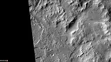 Layers and dark slope streaks in northeastern edge of Janssen Crater, as seen by CTX camera (on Mars Reconnaissance Orbiter). Note: this is an enlargement of the previous image of Janssen Crater.