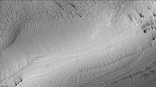 Reynolds crater showing streaks from defrosting, as seen by CTX camera (on Mars Reconnaissance Orbiter).  Layers are also visible.  Note: this is an enlargement of the previous image of Reynolds crater.  Streaks are caused by pressurized carbon dioxide blowing out dust that is blown by the wind into streaks.