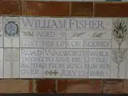 A tablet formed of five tiles of varying sizes, bordered by yellow and blue flowers in an art nouveau style