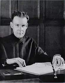 Photograph of Murphy seated at desk