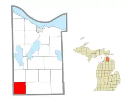 Location within Cheboygan County (red) and an administered portion of the village of Wolverine (pink)