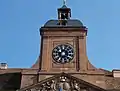 Tower with clock and ridge turret