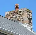 This modern house incorporates witches' stones in its chimneys