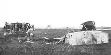  A photograph of a wrecked Tiger tank in a field