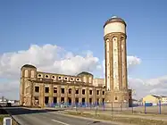 Wolfen, water tower and power plant on the site of the former ORWO film factory, producer of VISTRA synthetic fiber, a strategic material in German warfare, World War II. The plant was listed as a historic monument in Saxony-Anhalt. Photo: current view, 2007. Author: M_H.DE