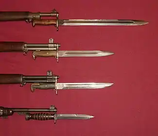 US military bayonets; from the top down, they are the M1905, the M1, M1905E1 Bowie Point Bayonet (a cut down version of the M1905), and the M4 Bayonet for the M1 Carbine. The top 3 blades each have fullers