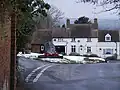 Location of the War Memorial, with former blacksmith's house on far side of the green.