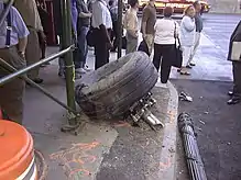 photograph of aircraft landing gear found amid debris.