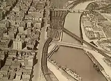 The four track viaduct in 1928, with the Sandridge Bridge crossing the Yarra and the turning basin still in use.