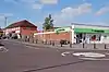 Street scene with modern brick built shop.