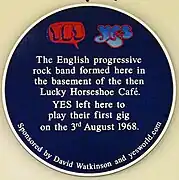 The Yes bubble logo on the blue plaque where Yes was formed in the basement of the then Lucky Horseshoe Café in 1968.