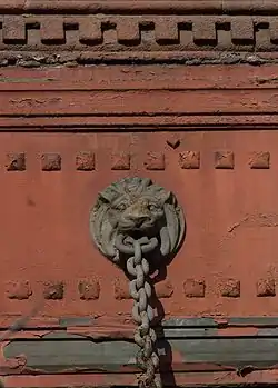 Lion supporting the canopy over the Columbus Avenue sidewalk