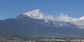 Lijiang, Yunnan province, (only city within Hengduan Shan) dwarfed by Jade Dragon Snow Mountain.