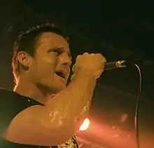 A man singing into a microphone