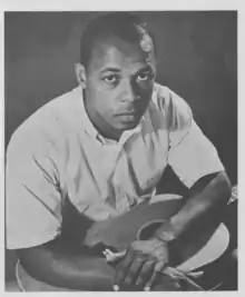 Promotional photograph of folk musician Al Cromwell, of Phinneys Cove, Nova Scotia, published in the 1963 program of the Mariposa Folk Festival.