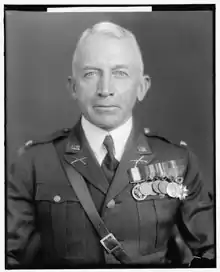 Black and white head and shoulders facing front photo of Lorenzo Dow Gasser in dress uniform with military awards, circa 1930