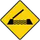 A diamond-shaped with yellow background and black border, with a symbol of an open draw bridge