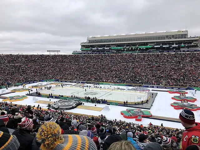 A football stadium with a hockey rink in the center